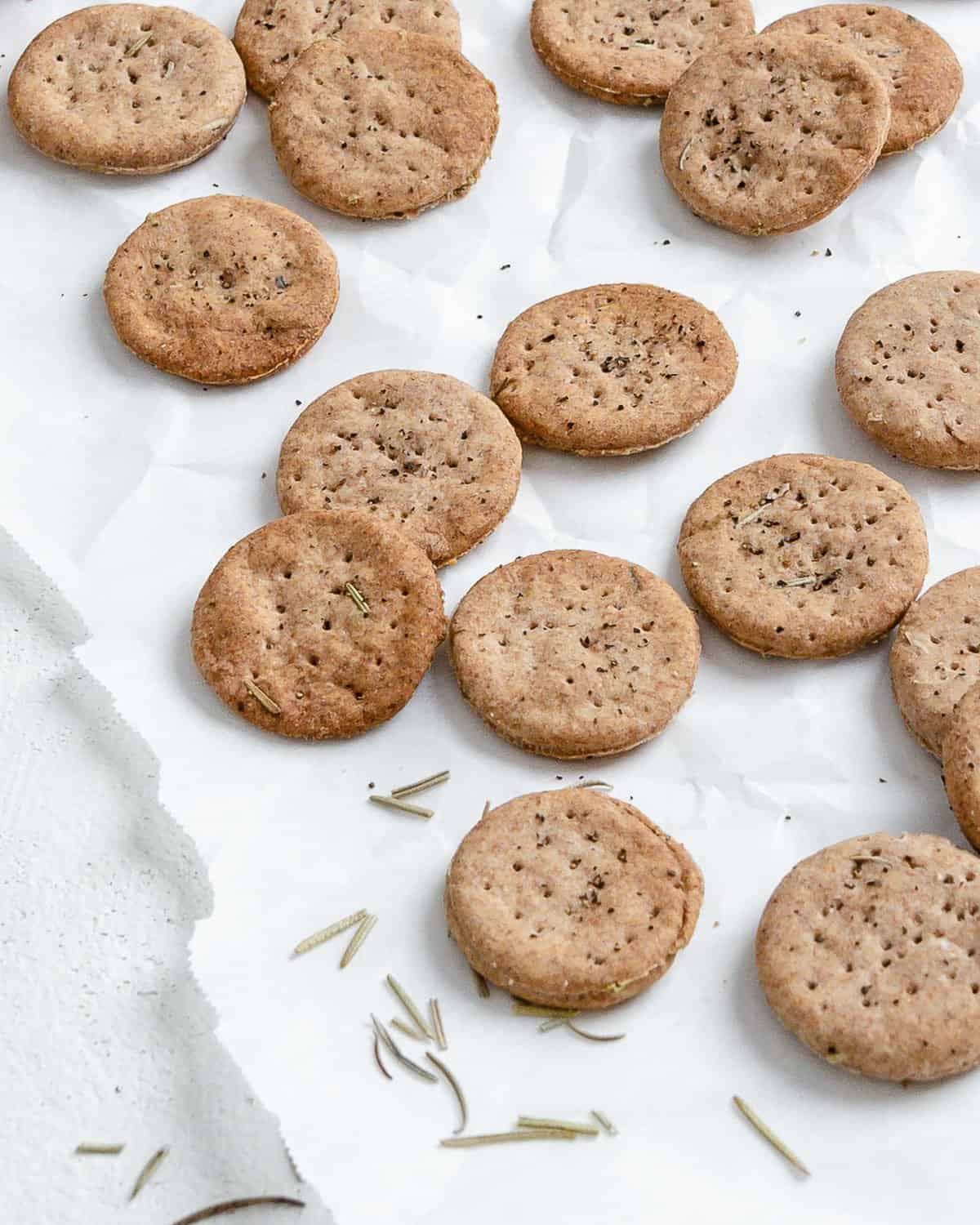 completed Rosemary Vegan Crackers scattered on a white surface