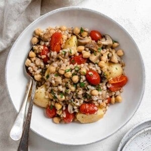 completed Easy Farro Recipe with Roasted Vegetables plated on a white plate
