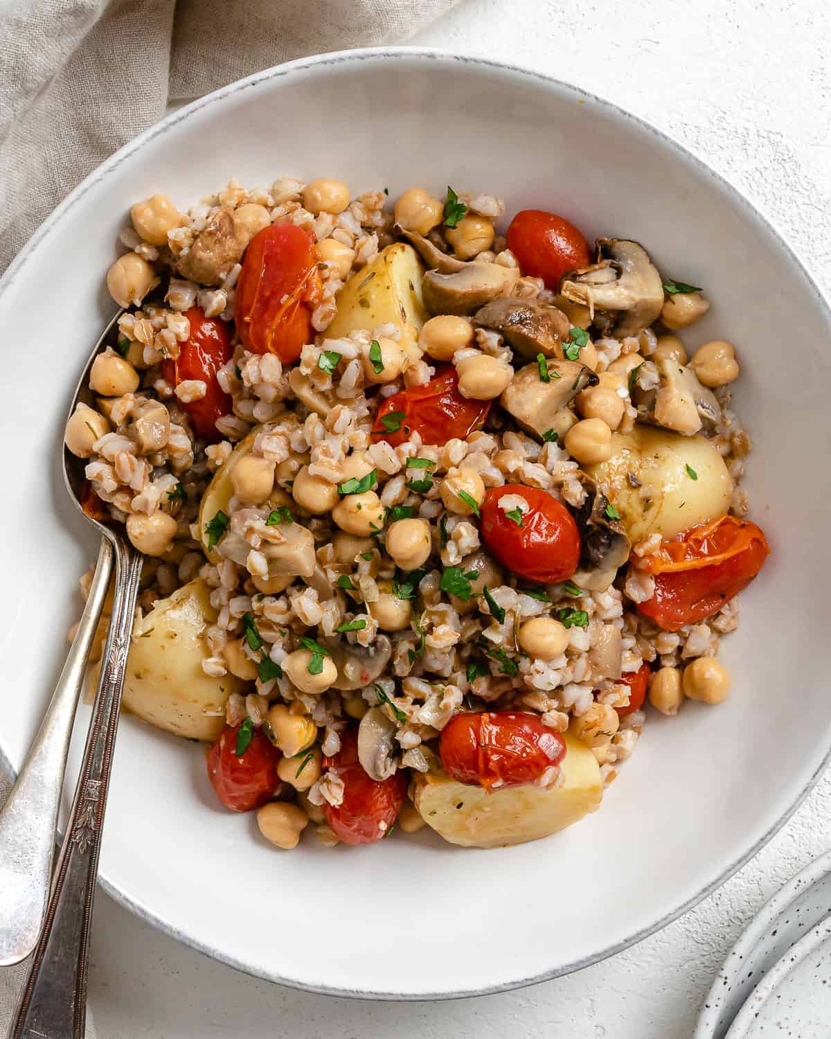 completed Easy Farro Recipe with Roasted Vegetables plated on a white plate