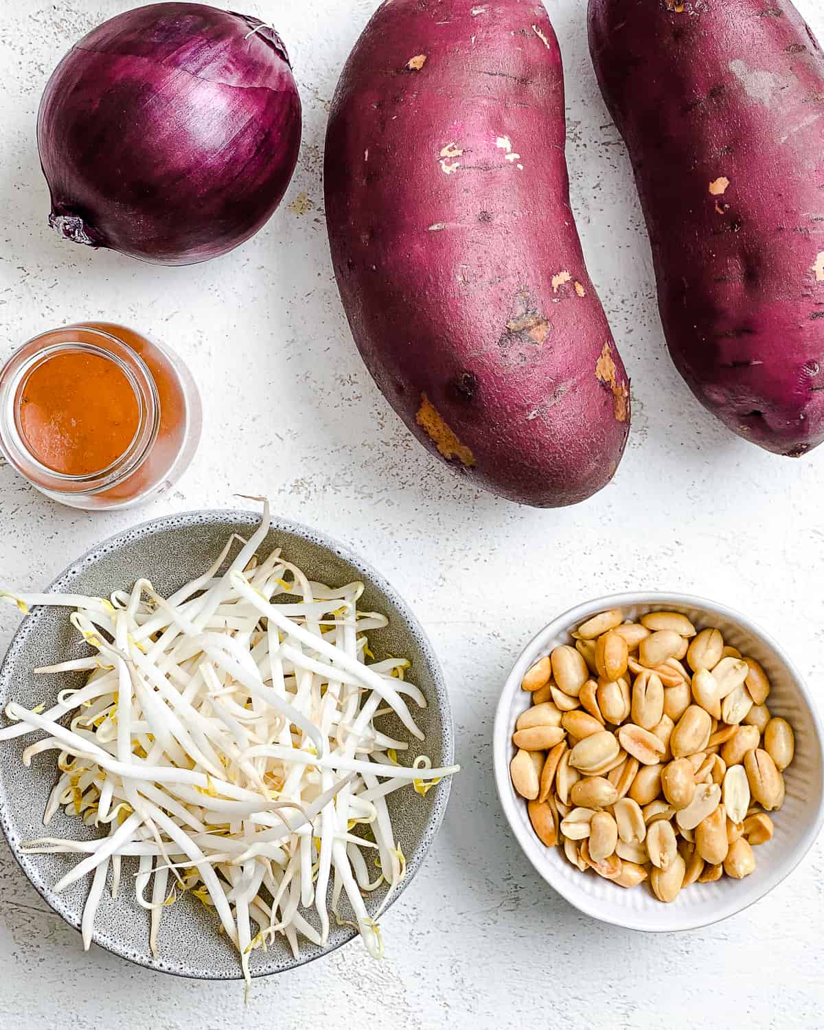 ingredients for Sweet Potato Bites with BBQ Mung Bean Sprouts measured out a،nst a white surface