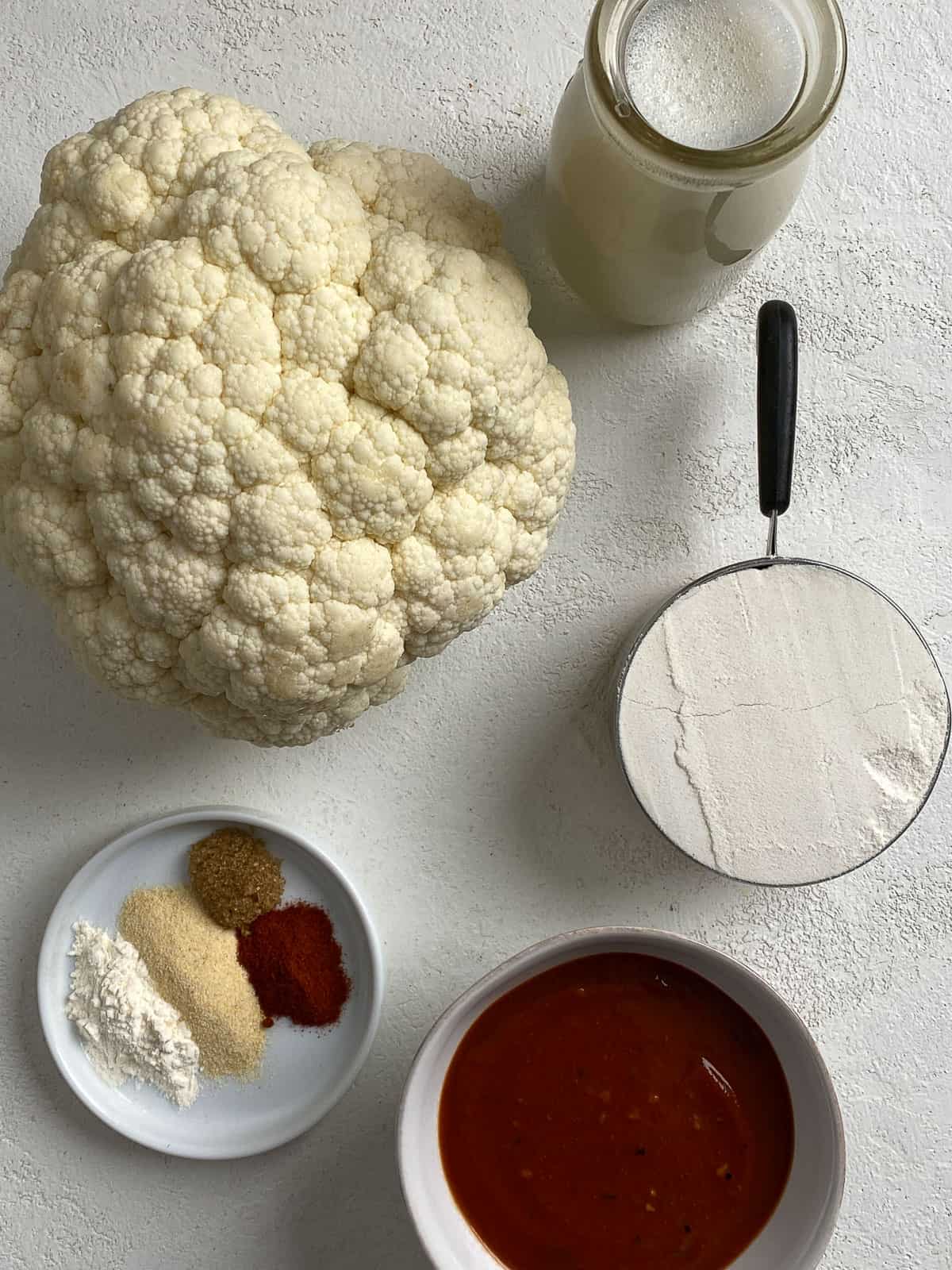 ingredients for BBQ Cauliflower Wings measured out against a light background