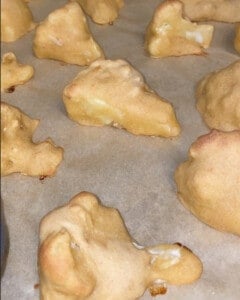 process shot post baking cauliflower wings against parchment paper