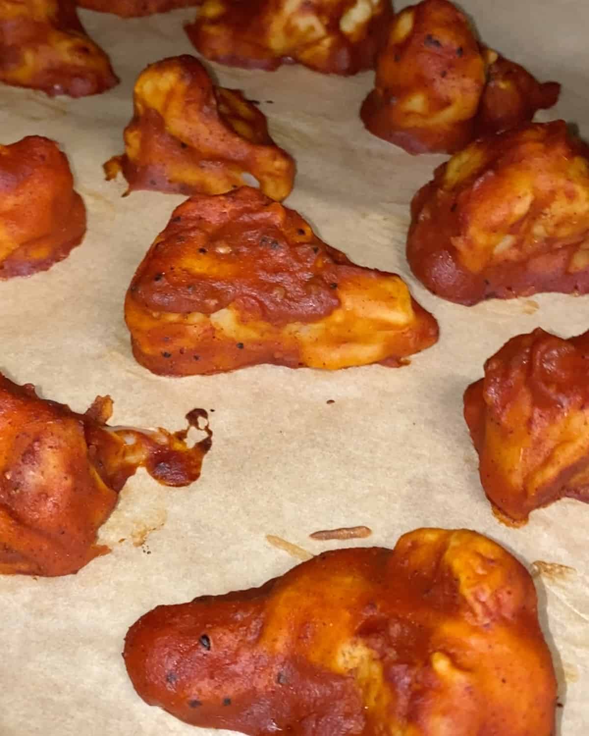 post baking cauliflower with bbq sauce on parchment paper