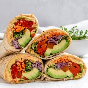 several completed Easy Hummus Tortilla Wraps on a white surface