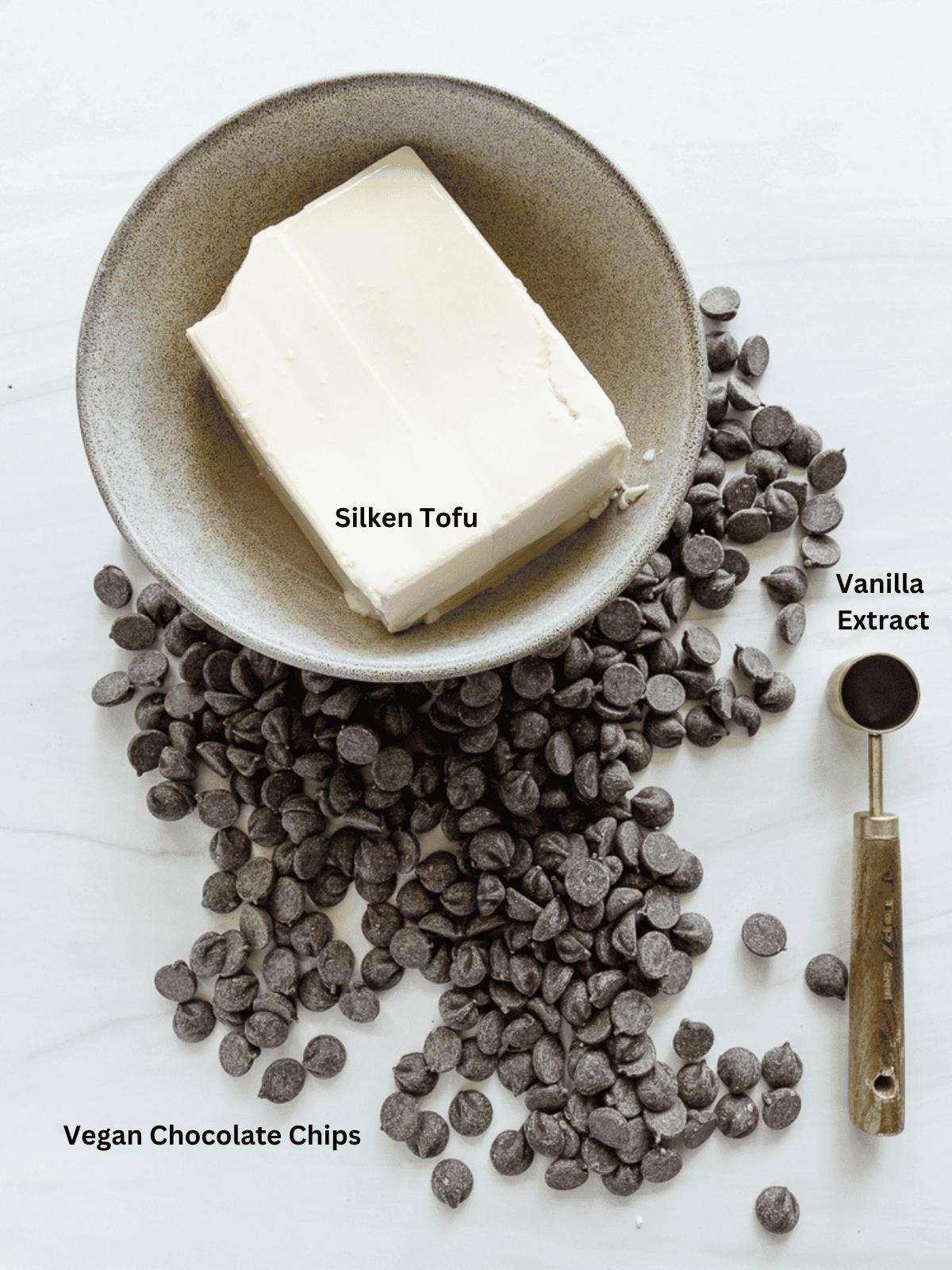 Ingredients for Super Simple Chocolate Mousse measured out on a white surface.