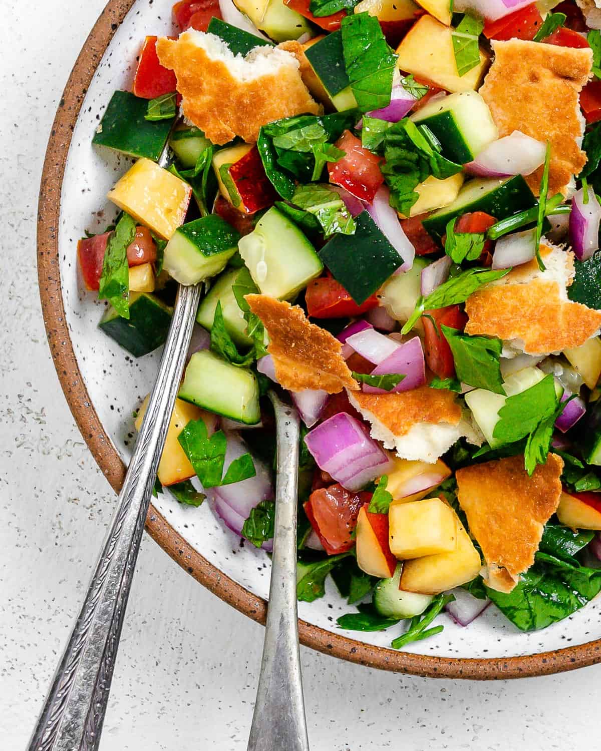 completed Easy Summer Fattoush Salad in a white bowl against a light background