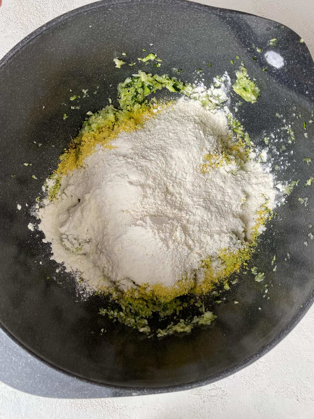 flour added to bowl of zucchini mixture
