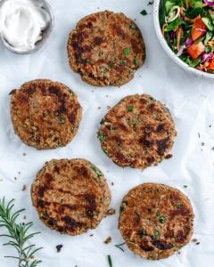 5 completed White Bean Burger patties against white surface