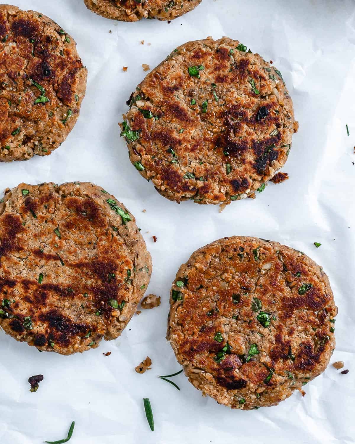 4 completed White Bean Burger patties against white surface