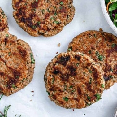 5 completed White Bean Burger patties against white surface