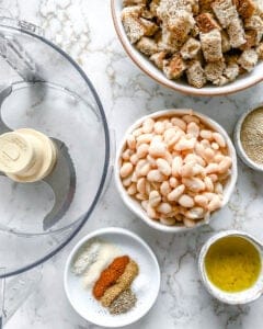 measured out ingredients for white bean burgers alongside food processor