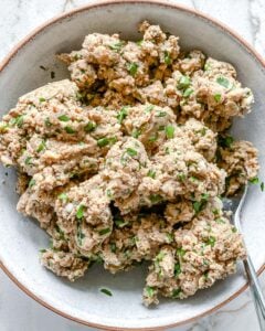 process of mashed mixture of White Bean Burgers in a white bowl