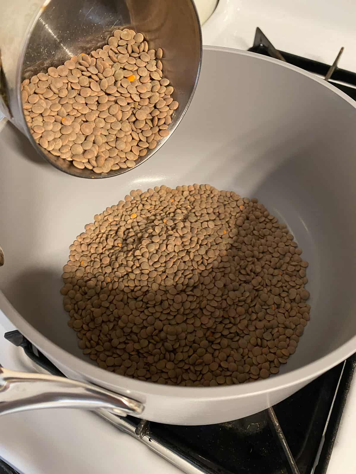 process shot of adding lentils to a bowl