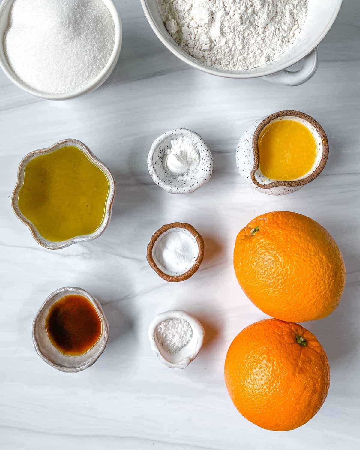 ingredients for Orange Olive Oil Cake against a white background