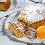 completed slice of Orange Olive Oil Cake against a white background