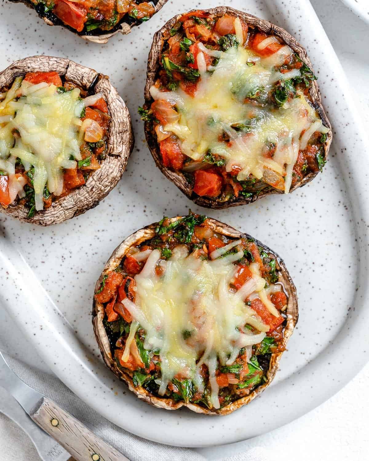 completed Portobello Mushroom Pizzas in a white serving tray