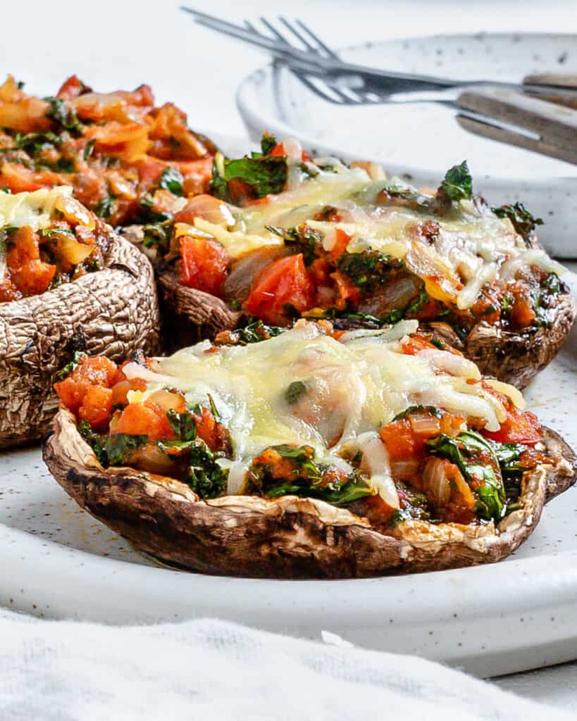 completed Portobello Mushroom Pizzas in a white serving tray