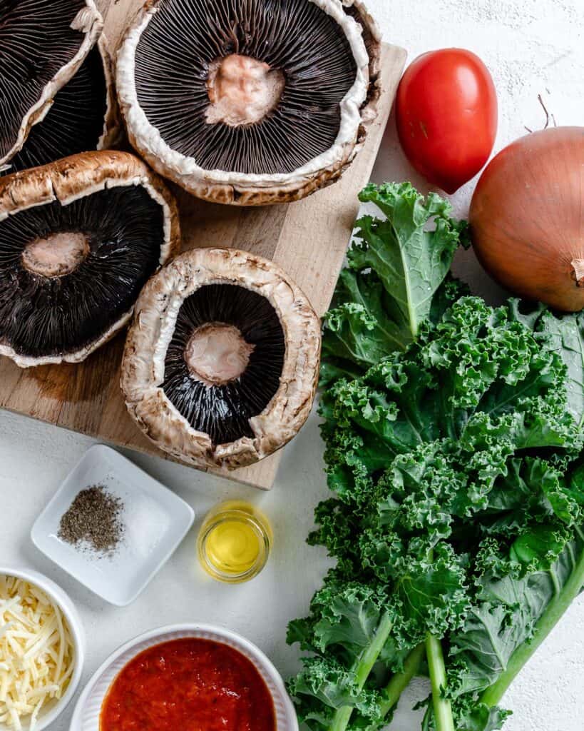 ingredients for Portobello Mushroom Pizzas against a white surfae