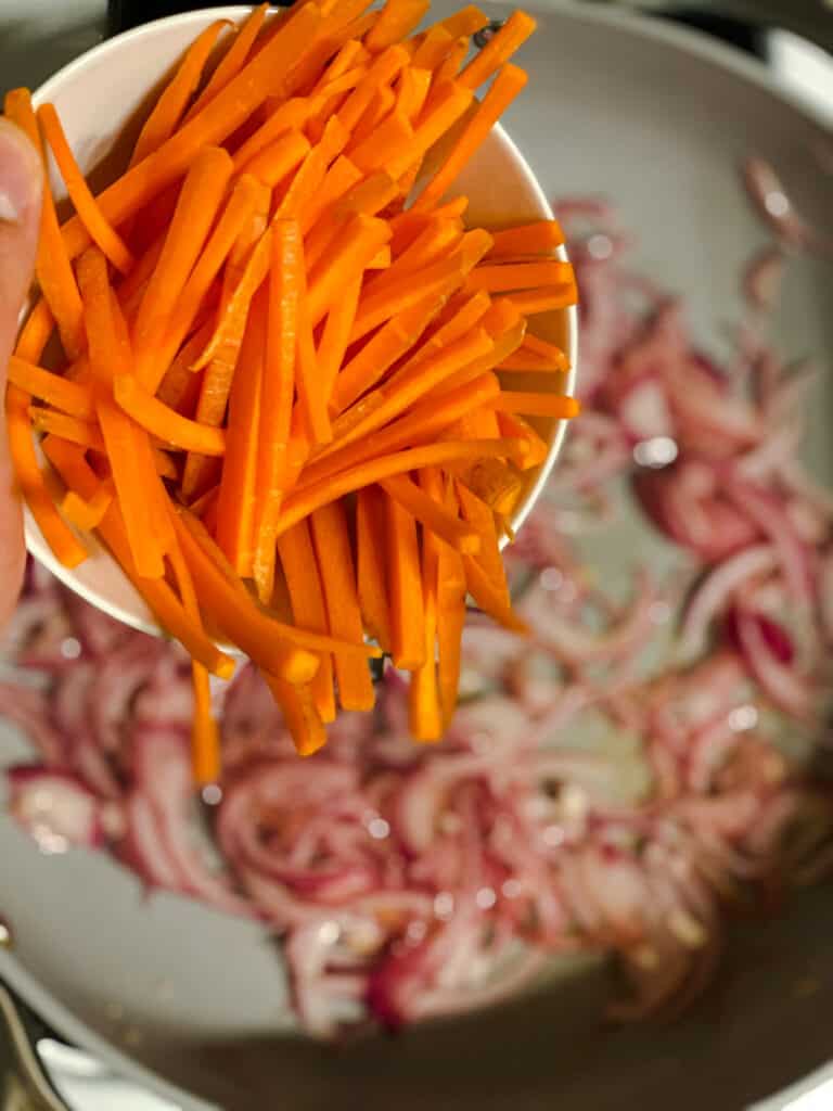process s،t of carrots being addd to pan