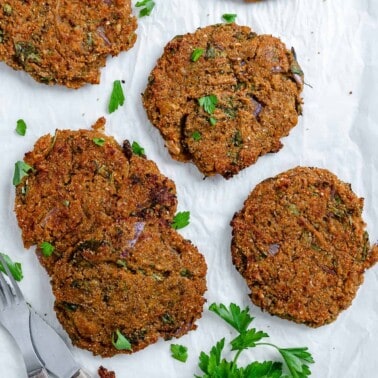 completed Easy Red Lentil Patties spread out on a white surface