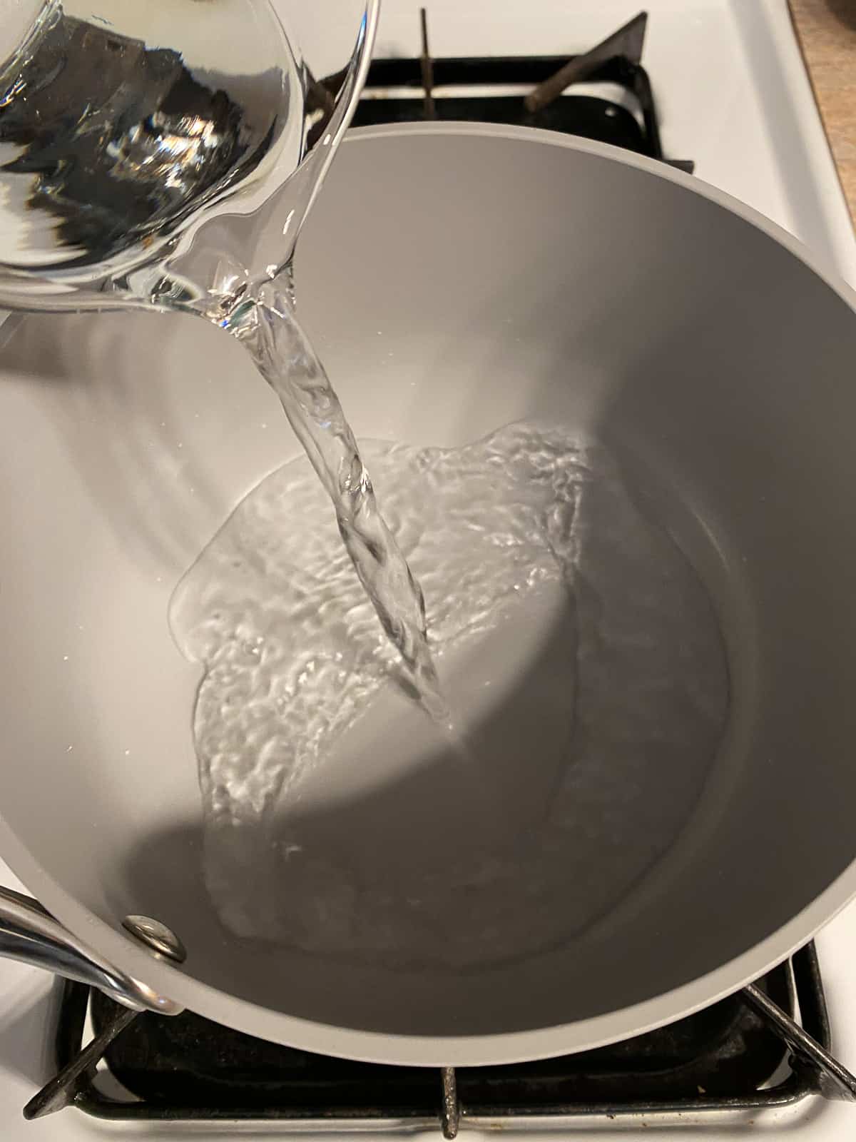 process of adding water to a bowl