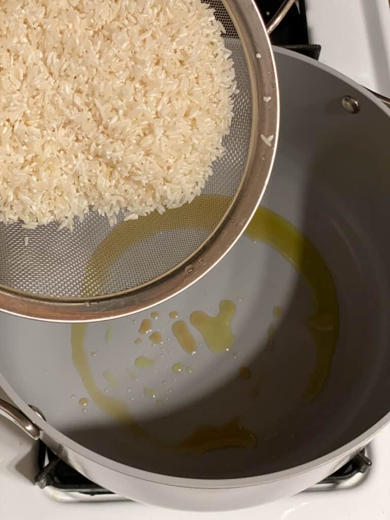 process shot of adding rice to pot