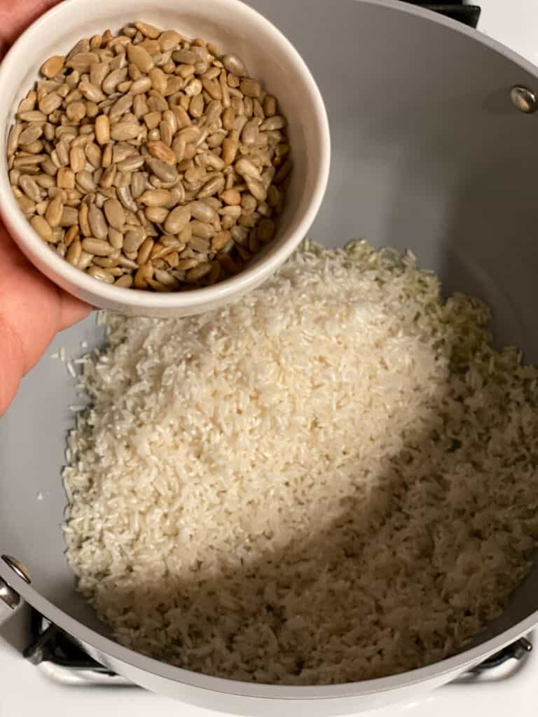 process shot of adding seeds to pot