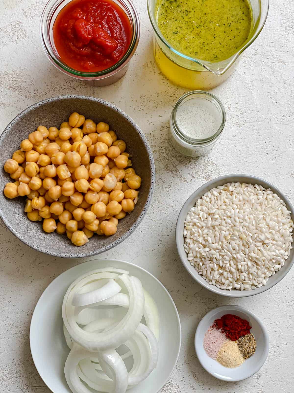 ingredients for Vegan Tandoori Chickpeas measured out against a white surface