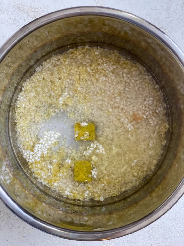 process shot of rice and oil added to slow cooker