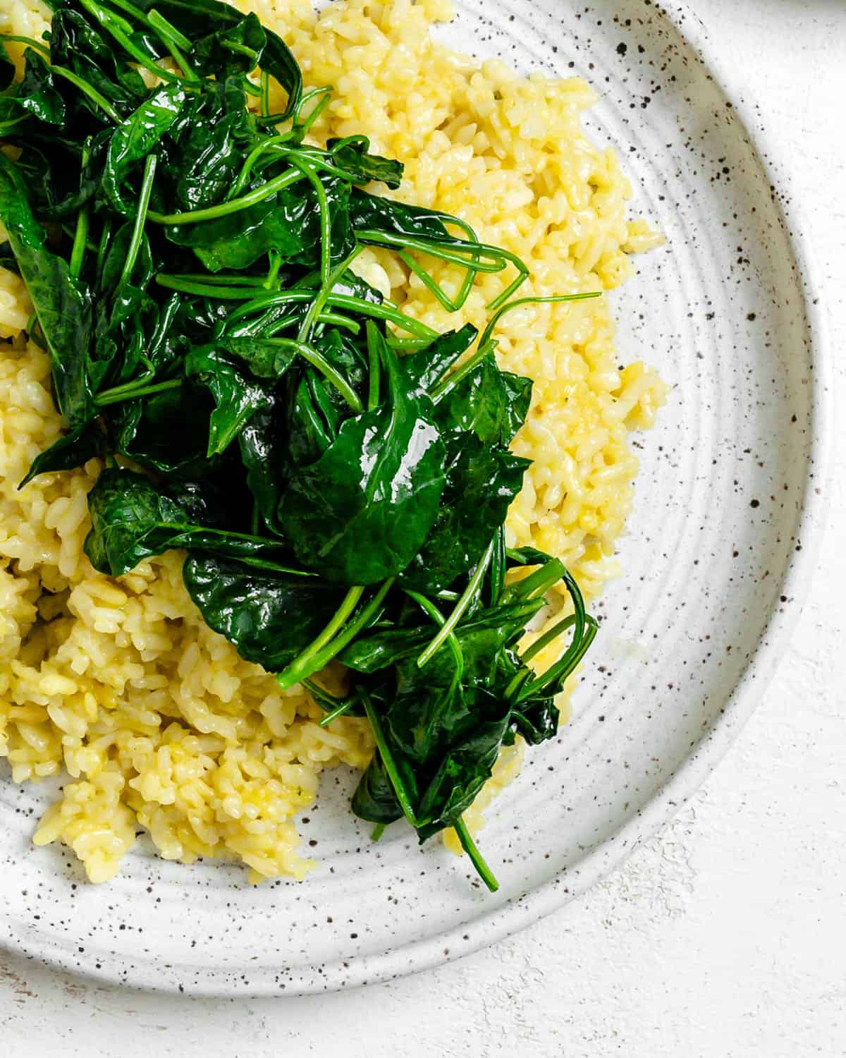 completed Slow Cooker Risotto with Kale plated on a white plate