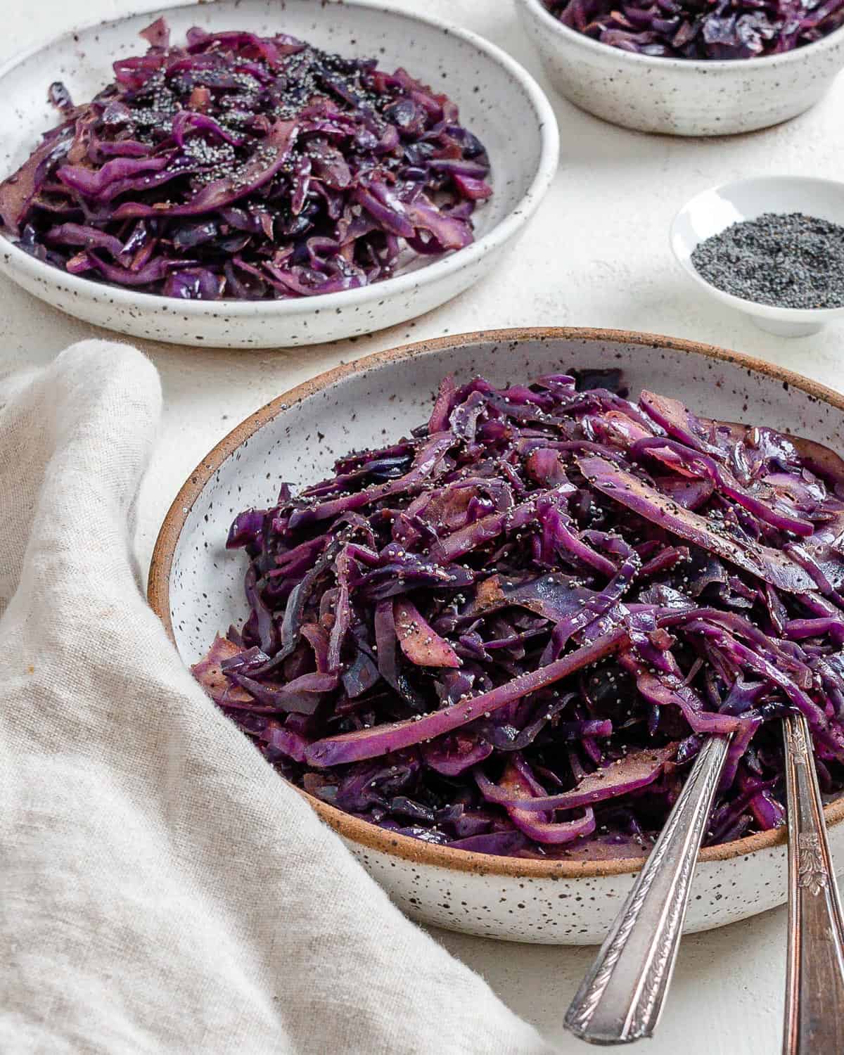 completed Easy Vegan Fried Cabbage plated in a bowl against a light background