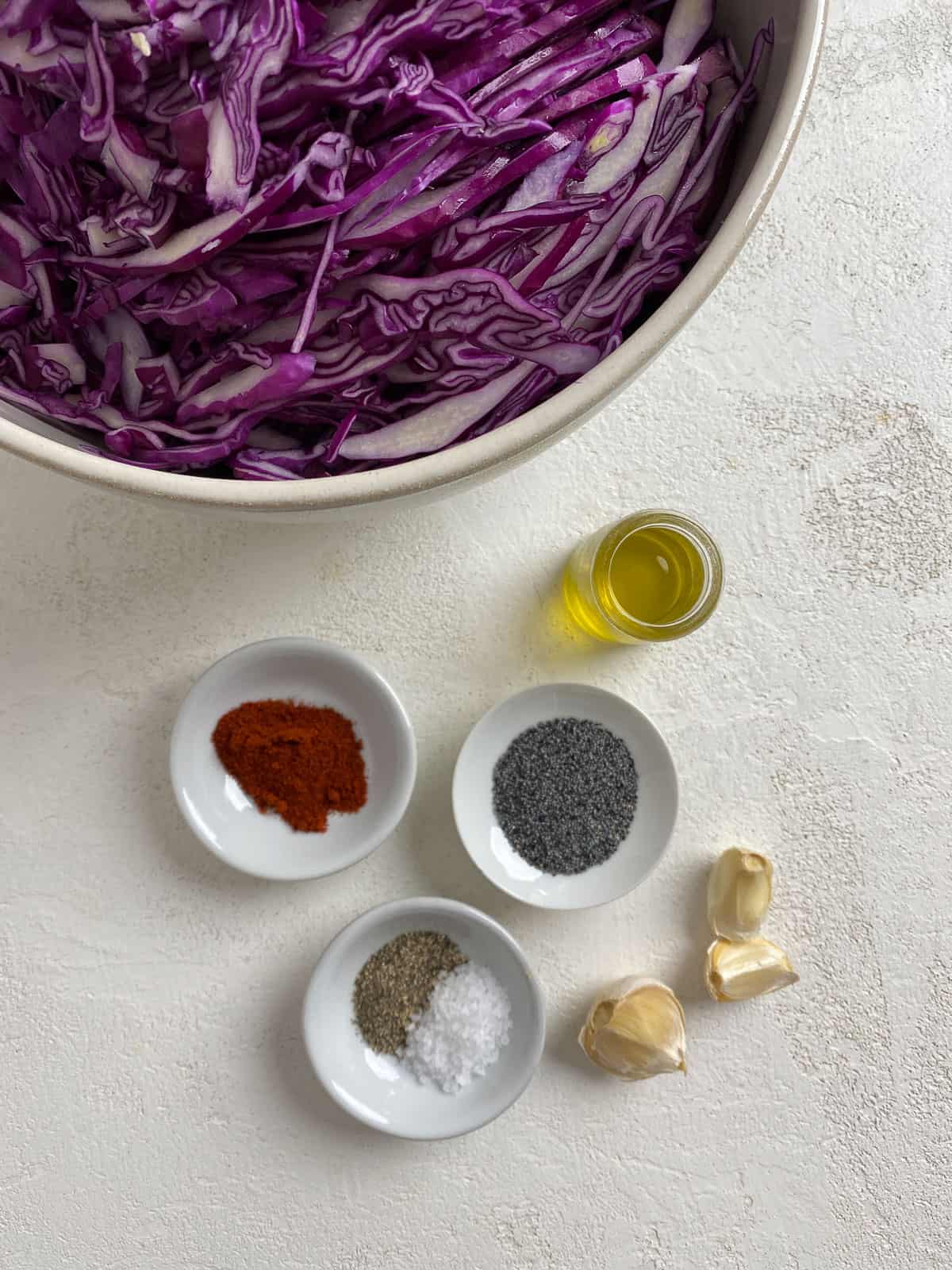 ingredients for Easy Vegan Fried Cabbage measured out against a light surface