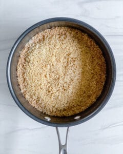 process showing cinnamon orange quinoa in a pot