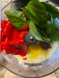 process shot showing veggies added to food processor