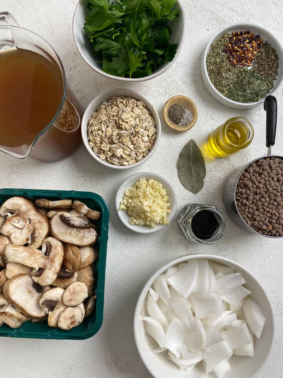 ingredients for Vegan Lentil Meatballs measured out against a white surface