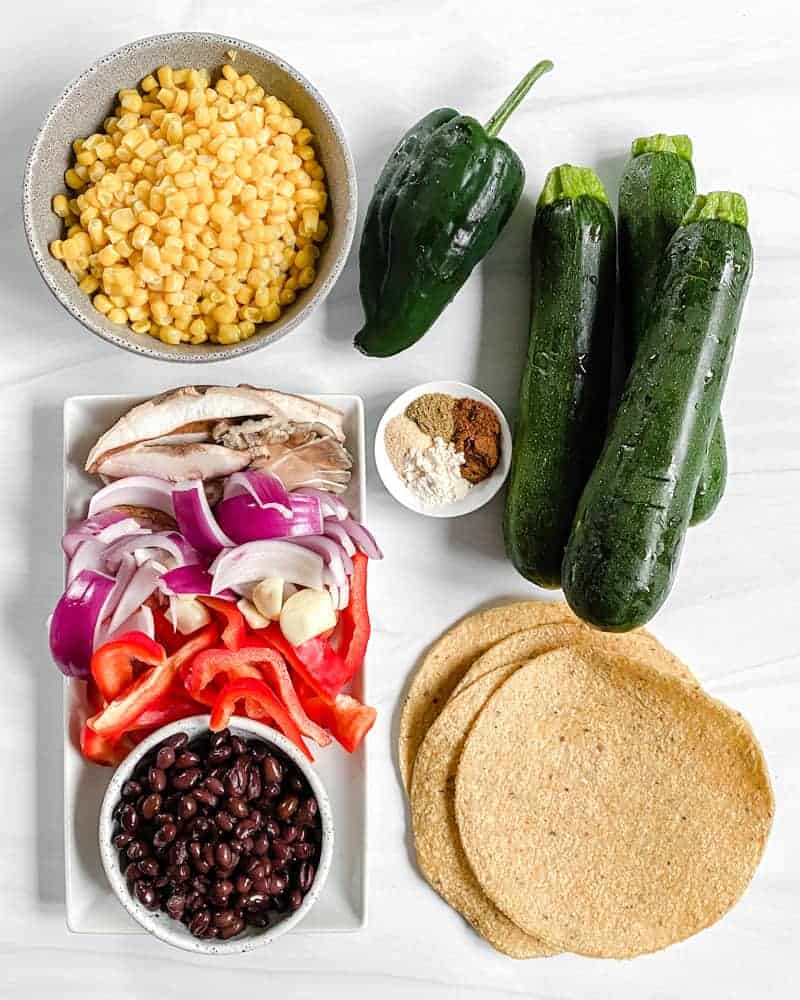 Vegan Roasted Veggie Tacos ingredients against a white background