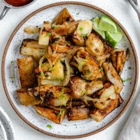 completed Crispy Home Fries plated on a white plate