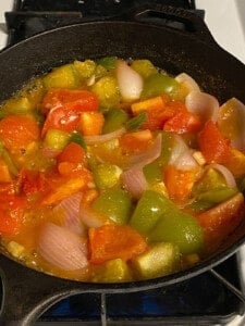 process shot of cooking veggies on a pan
