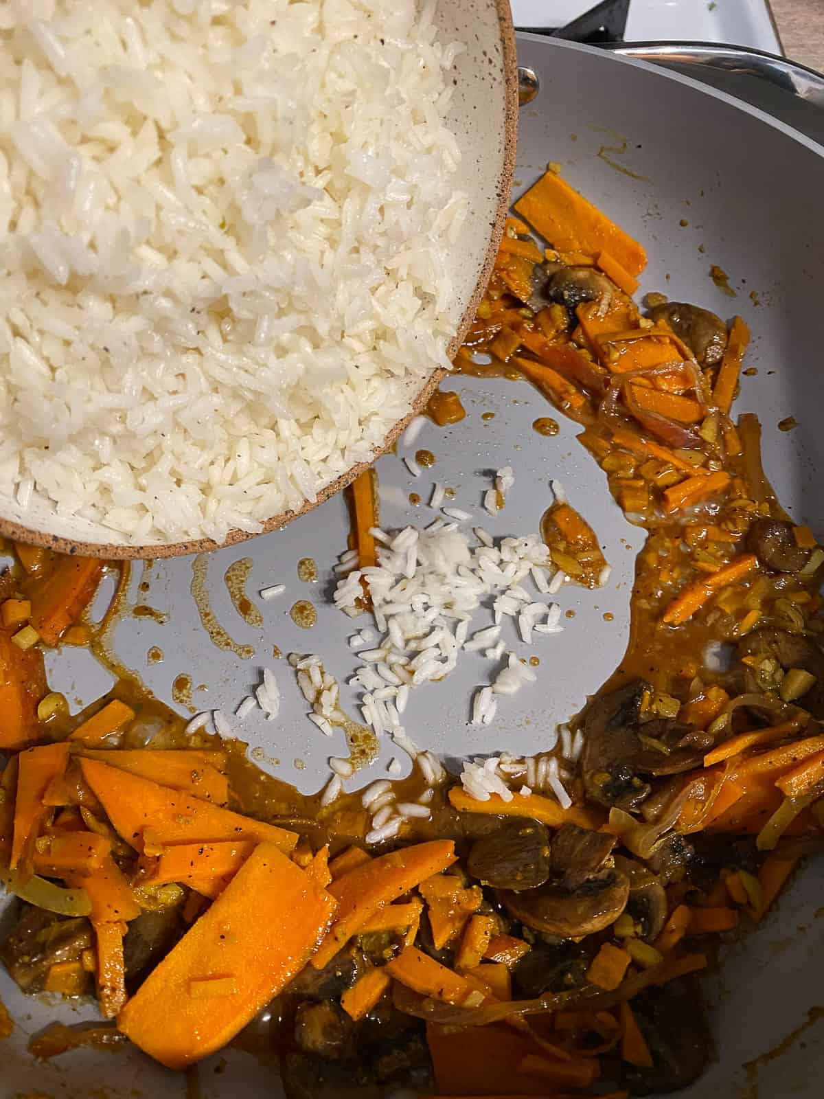 process of adding rice to pan