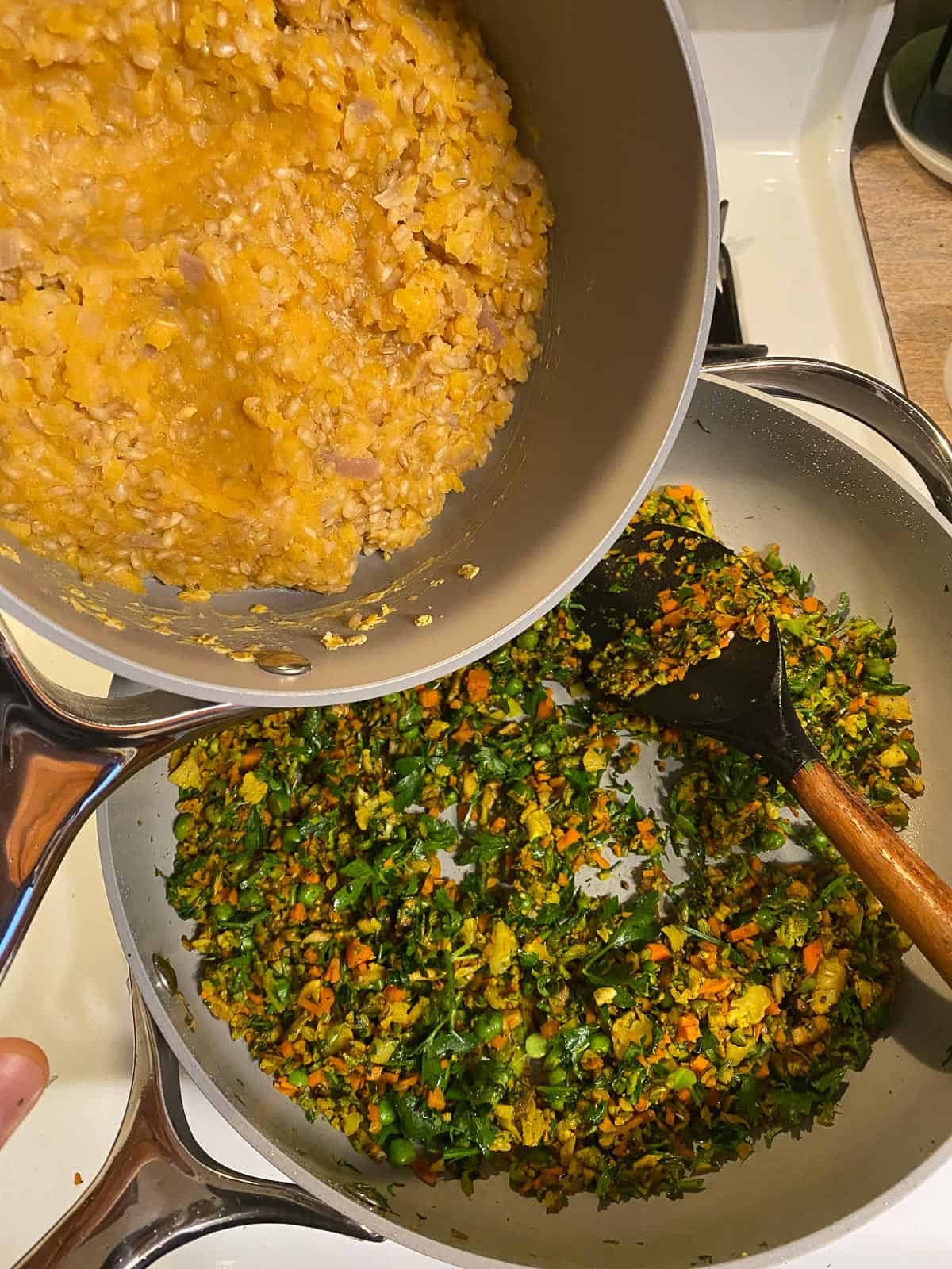 Process shot of adding a lentil and rice mixture to the pan