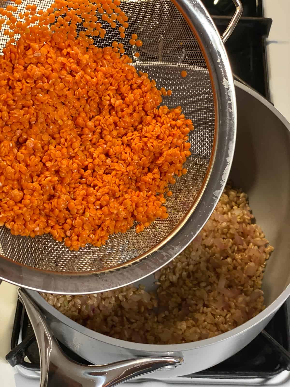 Process of adding lentils to the bowl