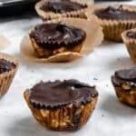 Completed No-Bake Peanut Butter Cups on a white surface.
