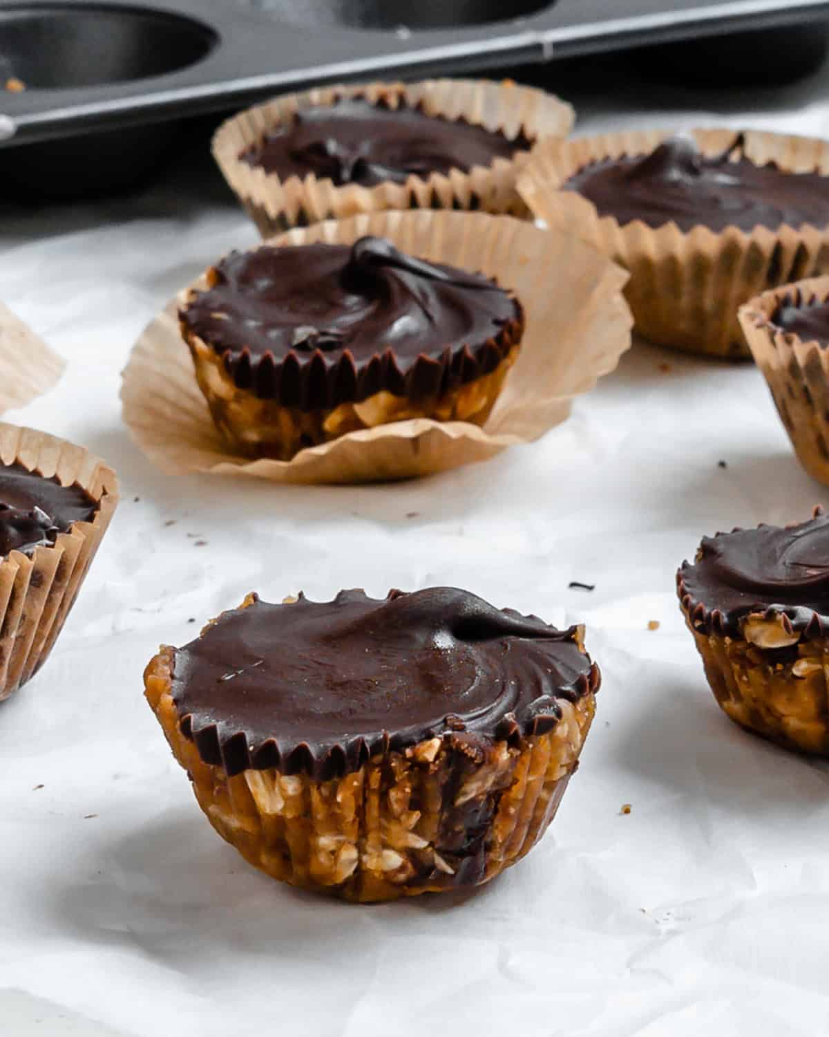 Completed No-Bake Peanut Butter Cups on a white surface.