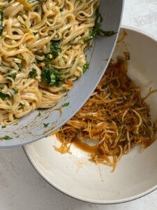process of adding cooked rice noodles to pan of veggies