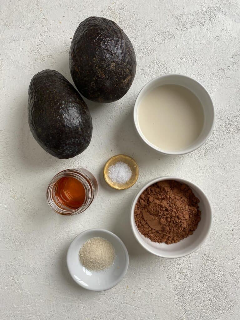 ingredients for Chocolate Avocado Pudding against a white background