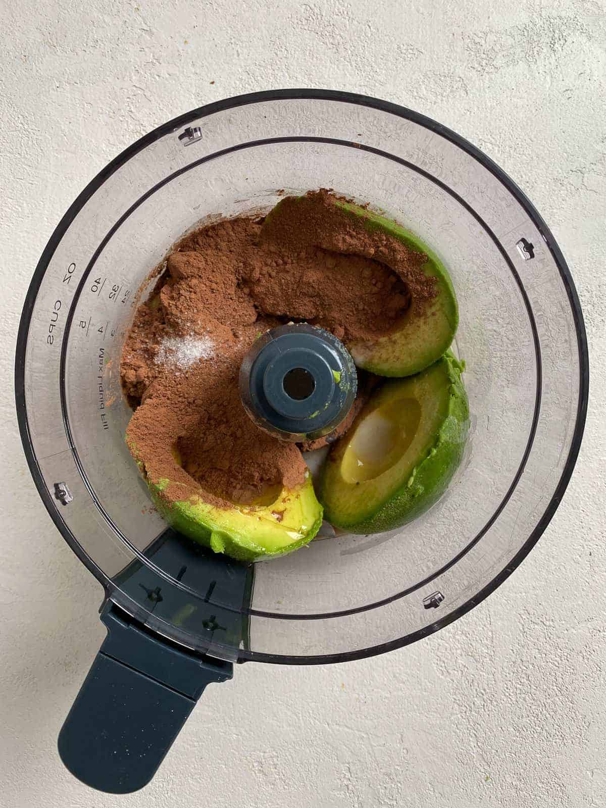 process shot of Chocolate Avocado Pudding ingredients in a food processor