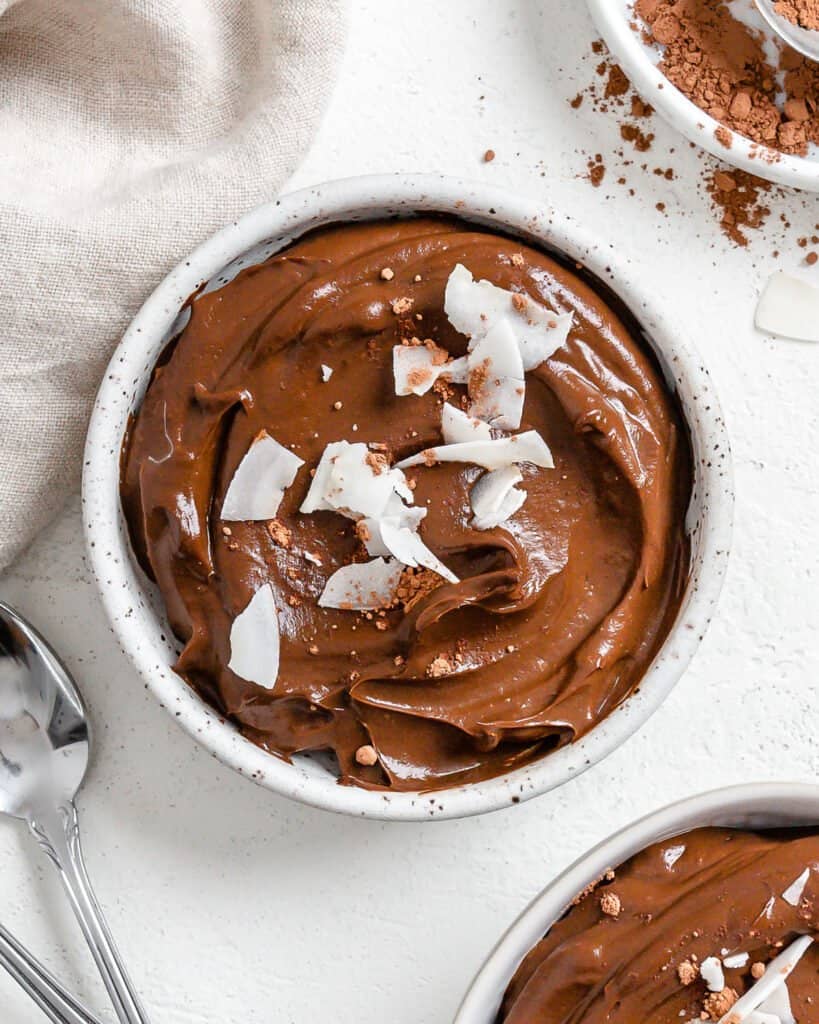 completed Chocolate Avocado Pudding in a white bowl against a white background