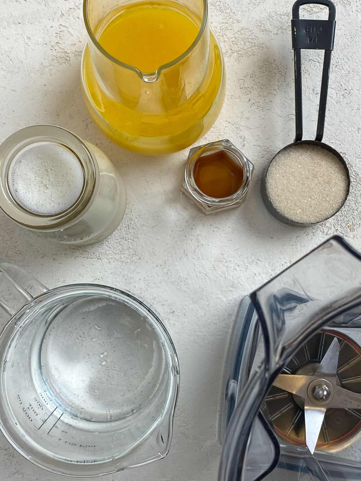 ingredients for Easy Orange Julius Smoothie Recipe measured out against a white surface