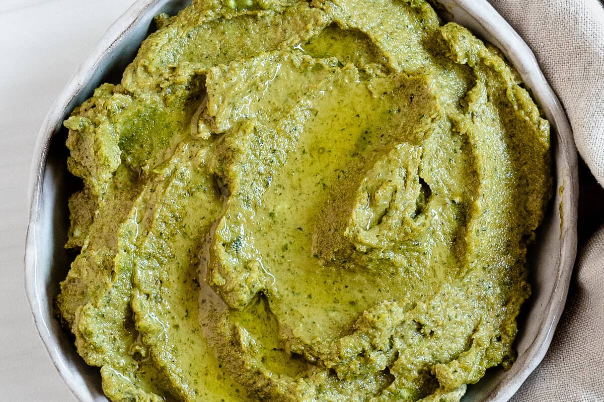 completed Sunflower Seed Pesto in a white bowl against a white background