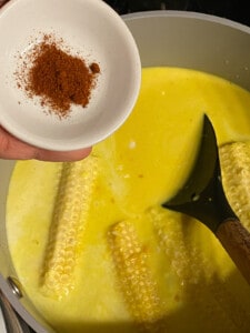 process of adding cayenne pepper to pan